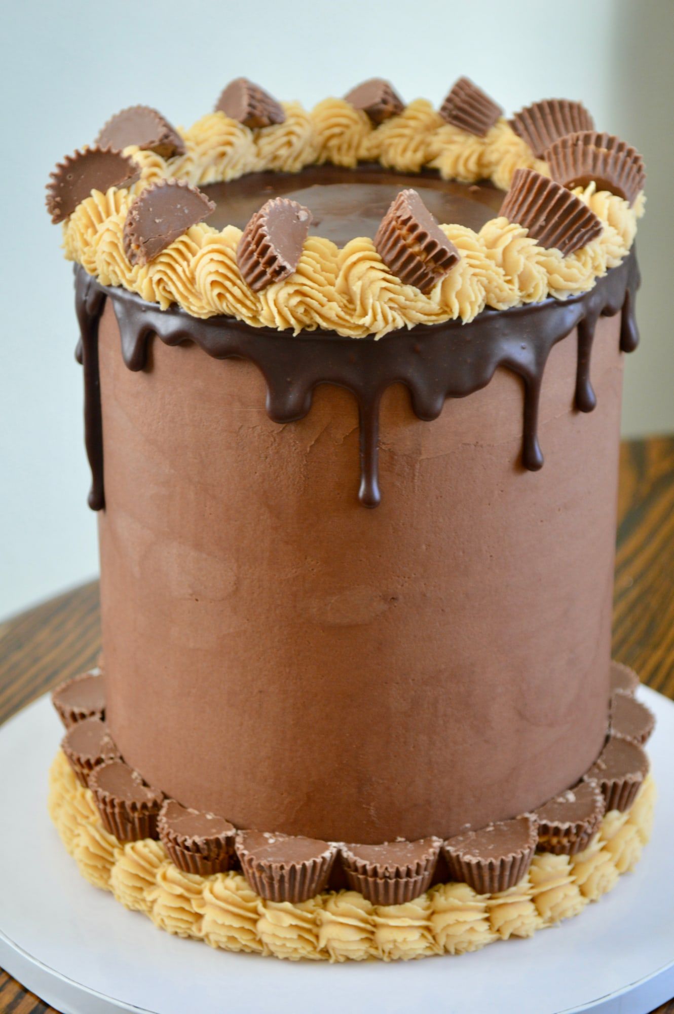 Chocolate cake with peanut butter buttercream, chocolate drip and peanut butter cups
